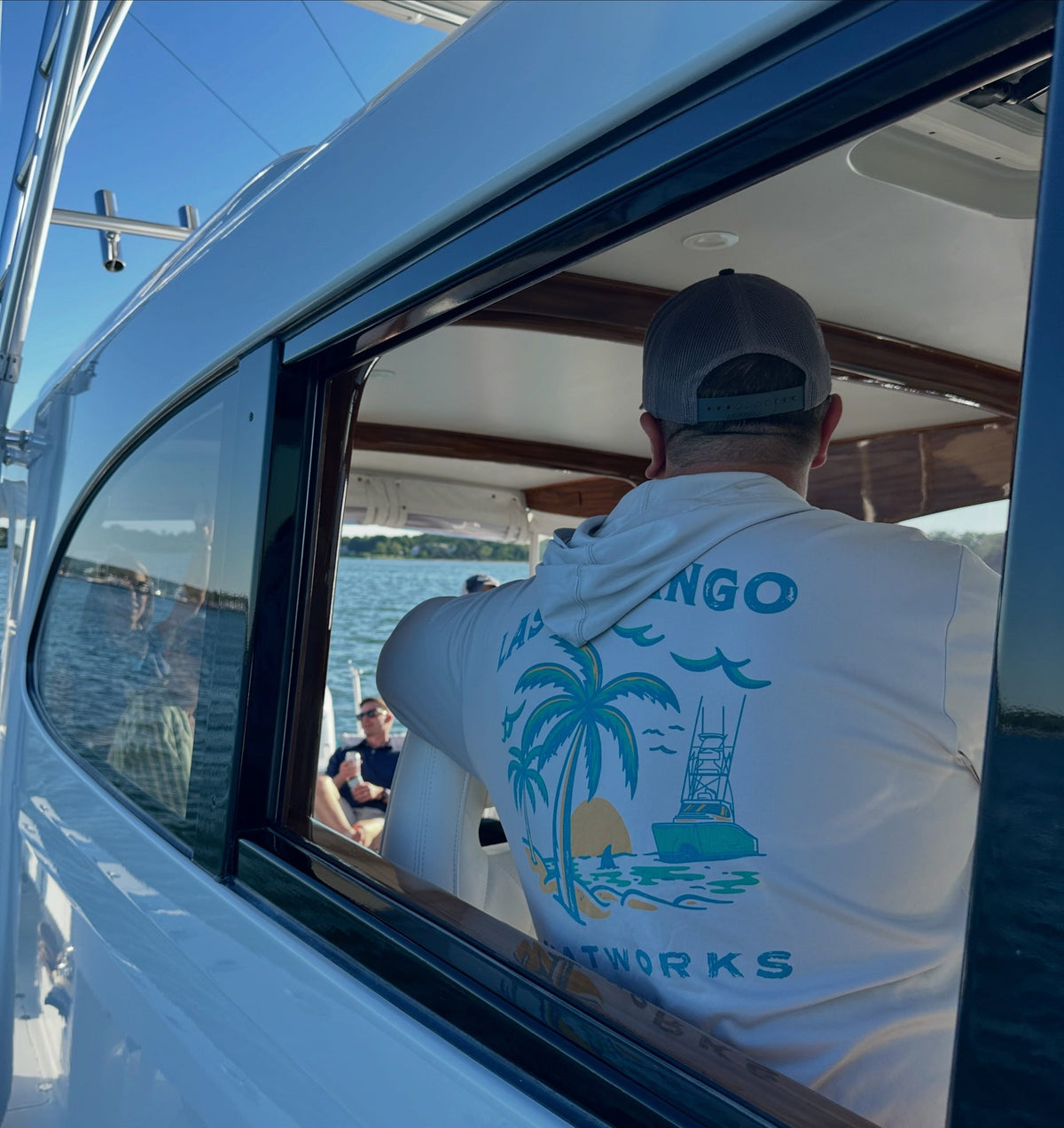 Captain Vinnie at the helm of the Last Mango
